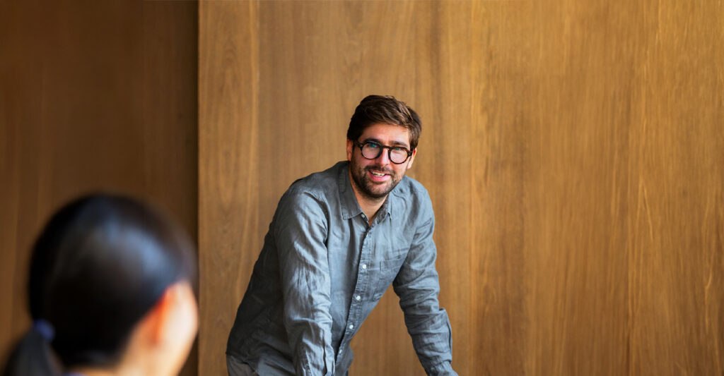 Smiling man in a casual shirt, a dedicated Solance account director